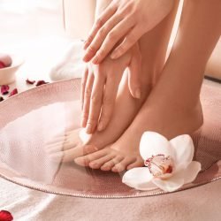 Young,Woman,Undergoing,Spa,Pedicure,Treatment,In,Beauty,Salon Young woman undergoing spa pedicure treatment in beauty salon